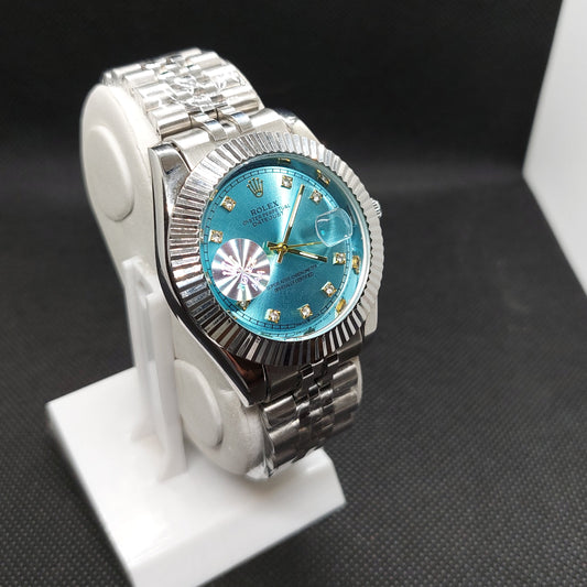 Rolex Date Oyster Perpetual - Silver Chain  - Cut Silver Case & Turquoise Dial - Saturn Watches
